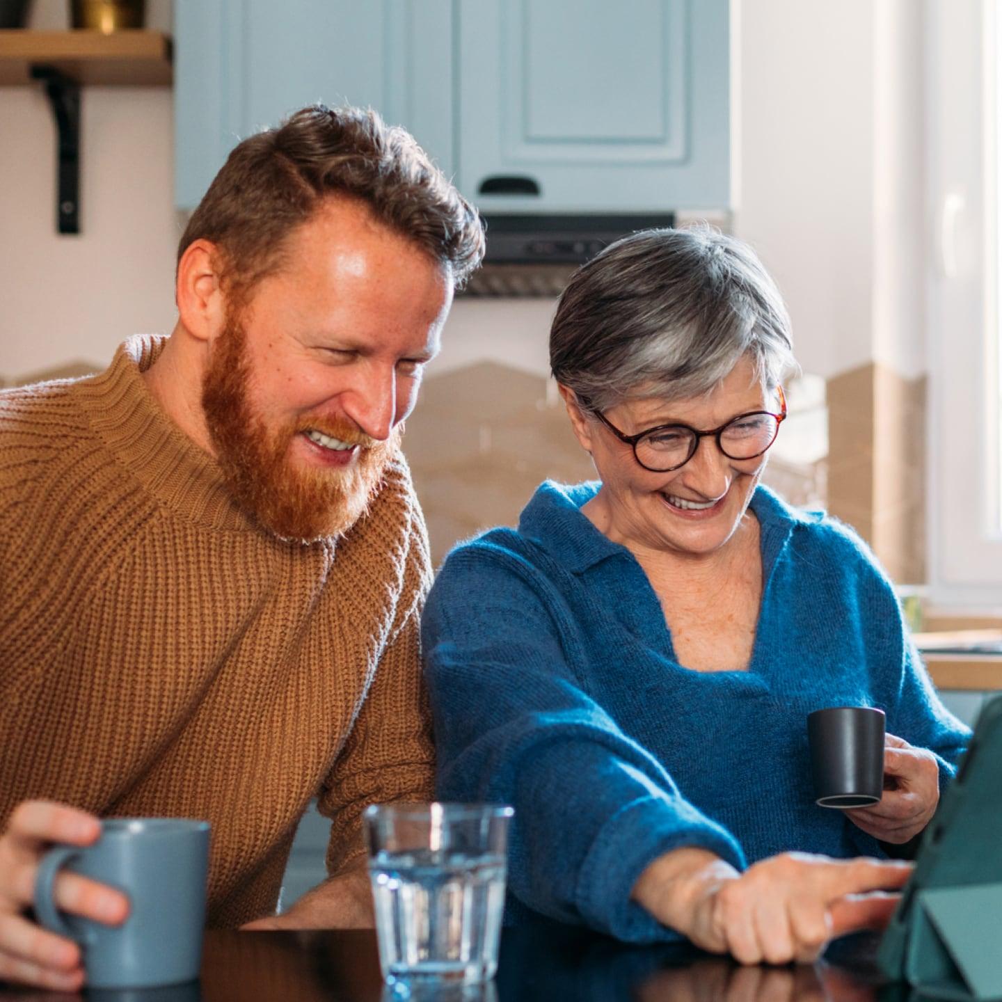 Mother and son using the computer