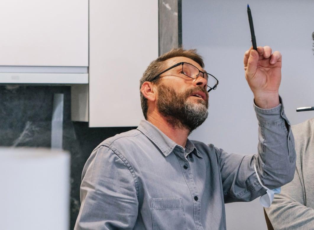 Handyman pointing out an issue