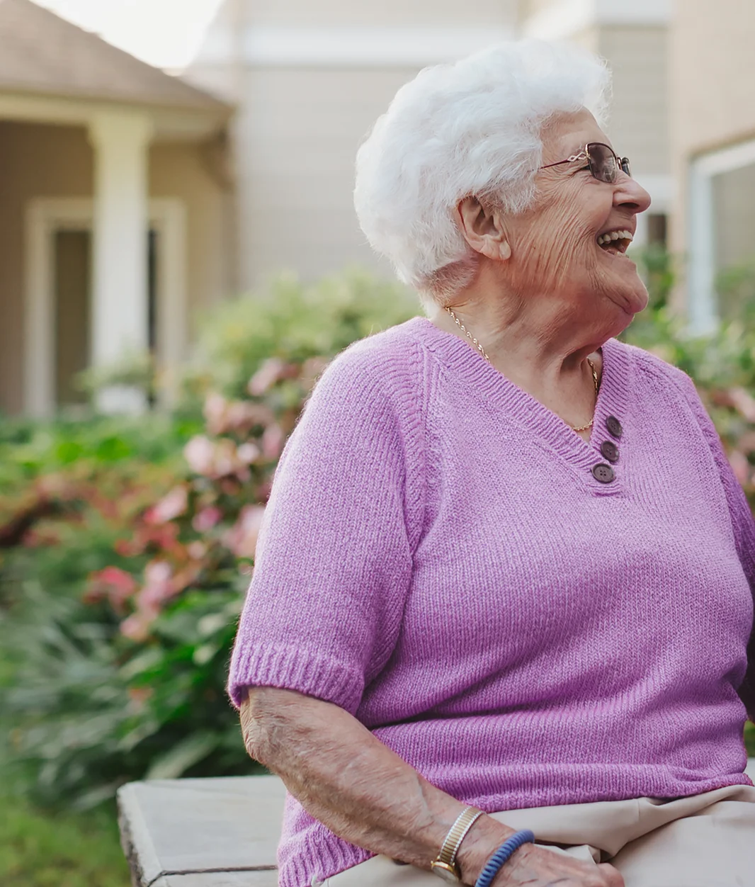 happy older woman in purple sweater smiling
